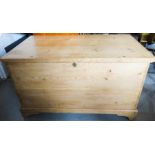 An antique pine blanket chest.