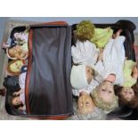 Twin dollies and various soft toys, quantity of 1950s dolls in a suitcase.