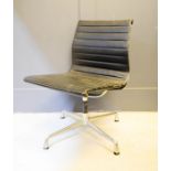 A Ray Eames black leather swivel chair, brushed chrome base.