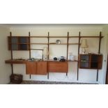 A teak wall shelving unit.