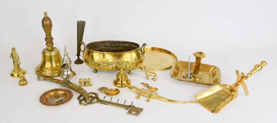 A group of brassware to include bell, jardiniere, chamber stick, crocodile and other pieces.