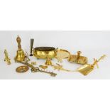 A group of brassware to include bell, jardiniere, chamber stick, crocodile and other pieces.