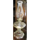 A Victorian oil burner with original glass shade and cone, 46cm high.