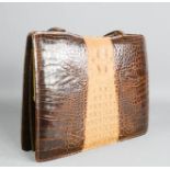 A vintage crocodile skin handbag.
