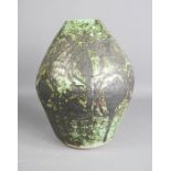 A German pottery vase, with green mottled glaze, 29cm high.
