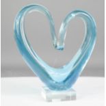 A Murano glass blue ornament in the form of a heart.