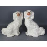 A pair of large Staffordshire dogs.
