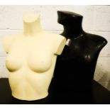 Two mannequin busts, man and woman in black and white, 50cm high.