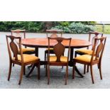 An Ercol dining table and chairs.