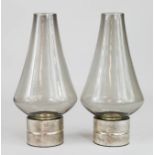 A pair of smoky glass candle holders, 25cm high.