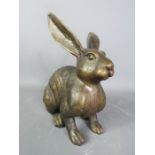A bronzed model hare.