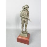 A Regimental statue of a soldier with a rucksack.