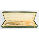 A silver and horn fork and spoon set, boxed.