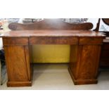 A 19th century mahogany side board, with shaped back rail.