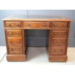 A 19th century partners desk of small proportions, with green leather top.