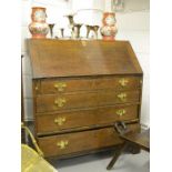 An 18th century oak bureau, with fitted interior, raised on bracket feet.