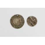 A 1567 Elizabethan silver coin and a similar example.