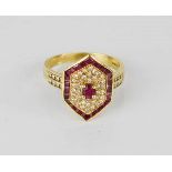 An 18ct gold, ruby and diamond ring, with cluster diamonds, 6g.