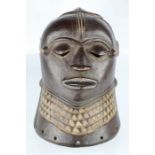 An African carved tribal face mask.