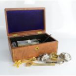 A leather domed jewellery box containing jewellery with bangles, necklaces etc.