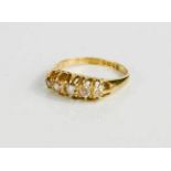 An 18ct gold and diamond ring, set with five graduated diamonds in a claw setting, size M, 3.5g.