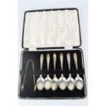 A set of silver spoons and sugar tongs in original box, 3.38toz.