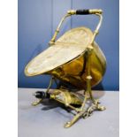 An Adam style Victorian brass helmet form coal scuttle and shovel, with brass and ebony handle.