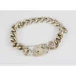 A silver chain bracelet with a heart form locket and safety chain, 1.8toz.