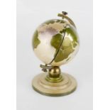 A rare vintage LMS globe design desk clock, 10cm high.