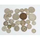 A group of antique coins, mostly with silver content.