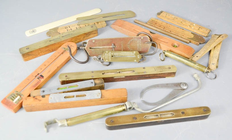A group of spirit levels, rulers and other tools.