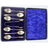 A set of six silver apostle spoons and sugar tongs, Chester 1903, Thomas Latham & Ernst, boxed.