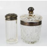Two silver and cut glass dressing table bottles.