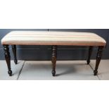 A Victorian mahogany window seat / long stool with upholstered seat.