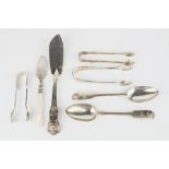 A pair of silver spoons, three pairs of sugar tongs, cake slice and knife with mother of pearl