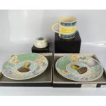 A group of four boxed Wedgwood Halleys Comet examples, a paperweight, mug and two plates.