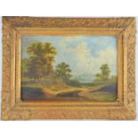 A 19th century oil on board, unsigned, depicting a solitary figure in landscape, 13 by 20cm.
