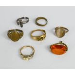 A group of rings including a 9ct gold example.