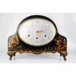 A German musical mantle clock, black lacquered, Chinoiserie decoration.