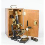 A Winkle of Gottingen microscope in a beech case, together with some slides of pollen and spores.