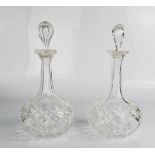 A pair of late Georgian glass decanters and stoppers 23cm high.