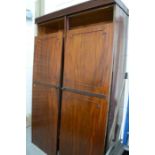 A mahogany wardrobe, with dentil moulded decoration.