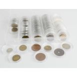 A quantity of various coins, worldwide examples, each in individual cases.
