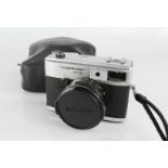 A Voigtlander VF101 camera by Rollei & Zeiss Ikon Nettar camera.