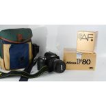 A Nikon F80 camera body, a Nikon AF Nikkor 28-105mm lens, a camera bag, the original boxes, and