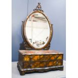 A Chinese export dressing mirror, on a serpentine base, fitted with two long drawers, oval