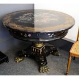 A 19th century Chinese centre table, with black lacquered circular top inlaid with mother of pearl