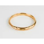 A 9ct gold bangle, 14.6g. A/F