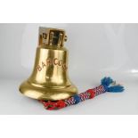 An original brass ships bell, complete with clapper, HMS Barcock, a British boom defence vessel of