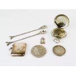 An arabic coin, a white metal chinese coin, two white metal chinese spoons, a silver vesta case an